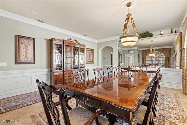 tiled dining room with crown molding