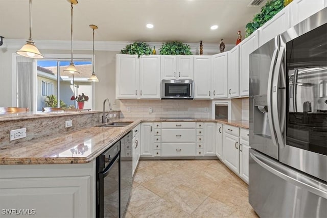 kitchen featuring white cabinetry, appliances with stainless steel finishes, sink, and light stone counters