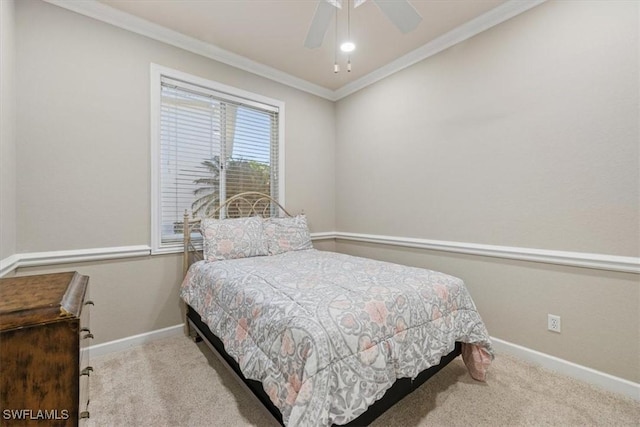 bedroom featuring crown molding, ceiling fan, and light colored carpet