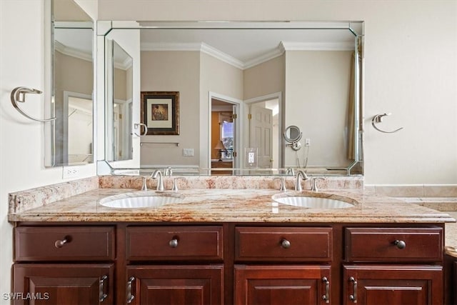 bathroom featuring vanity and ornamental molding