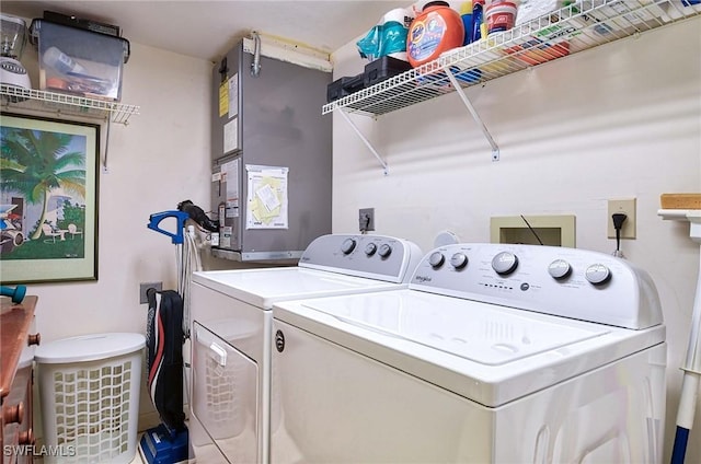 clothes washing area with washing machine and clothes dryer