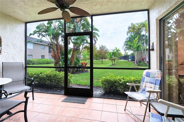 sunroom / solarium with ceiling fan