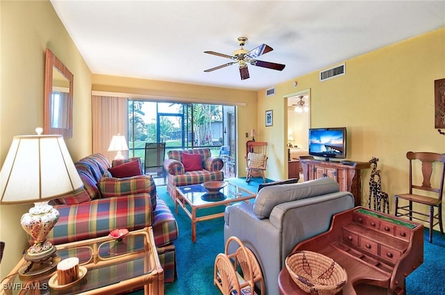 living room featuring carpet flooring and ceiling fan