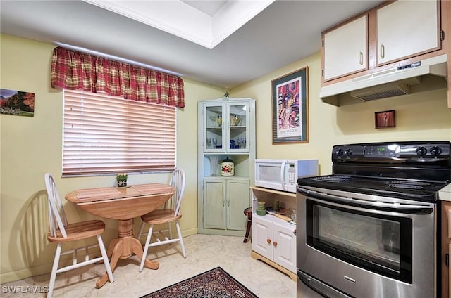 kitchen with stainless steel electric stove and white cabinets