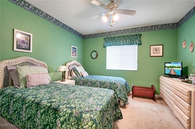 bedroom featuring ceiling fan and carpet floors