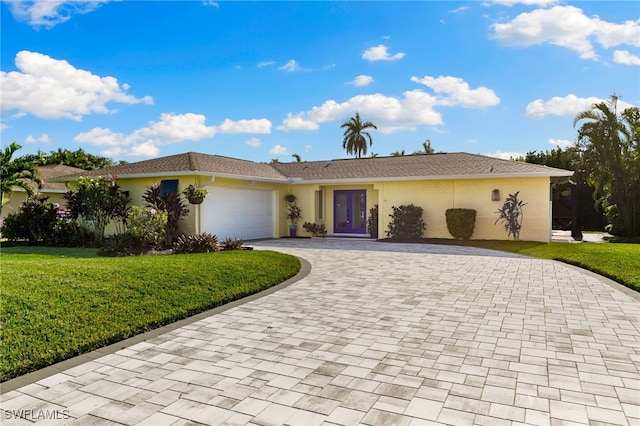 230 Pine Valley Cir, Naples, FL 34113 - ranch-style home featuring a garage, a front lawn, decorative driveway, and stucco siding