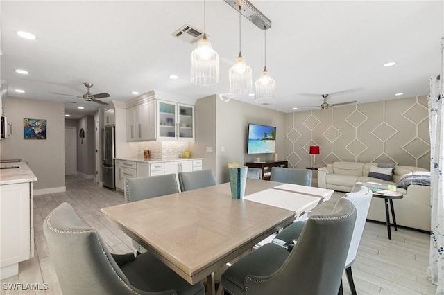 dining space featuring ceiling fan