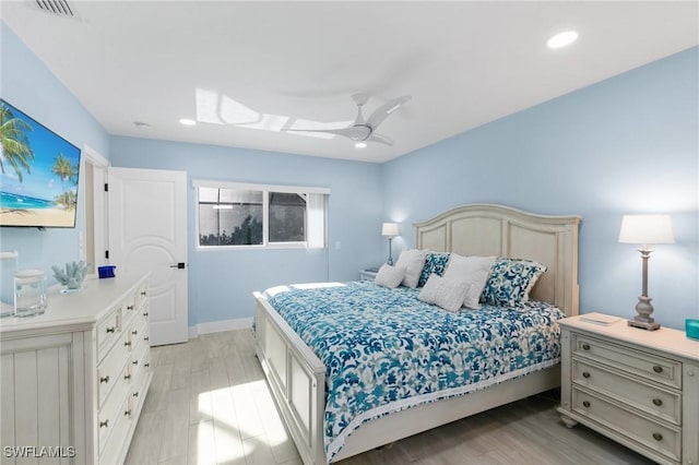 bedroom with ceiling fan and light wood-type flooring