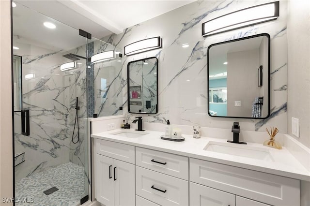 bathroom featuring vanity and an enclosed shower