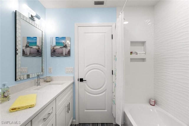 bathroom with vanity and shower / bathtub combination with curtain