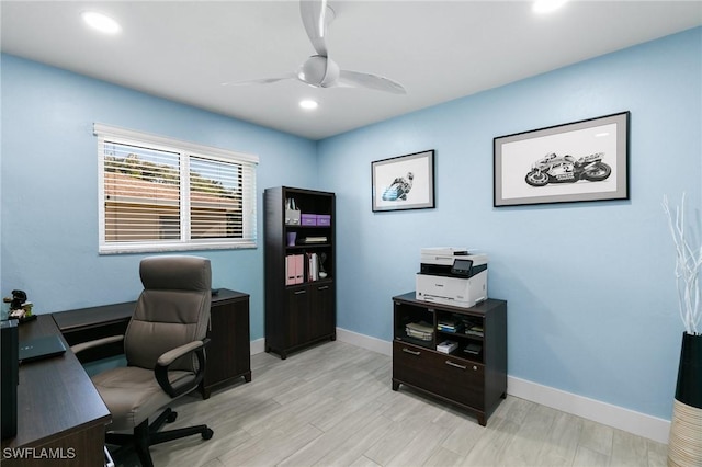 home office featuring light hardwood / wood-style floors and ceiling fan