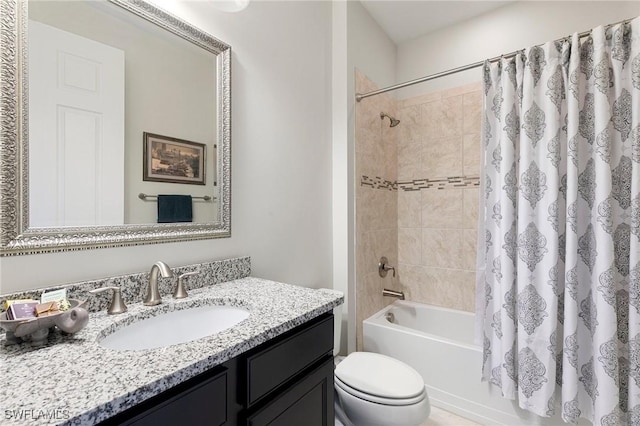 full bathroom with vanity, toilet, and shower / tub combo with curtain