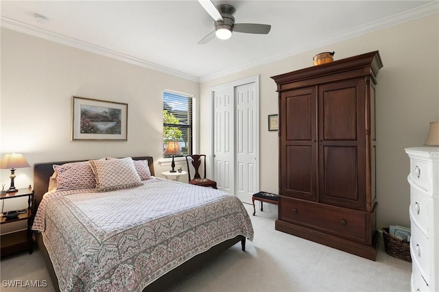 bedroom with ceiling fan, ornamental molding, light carpet, and a closet