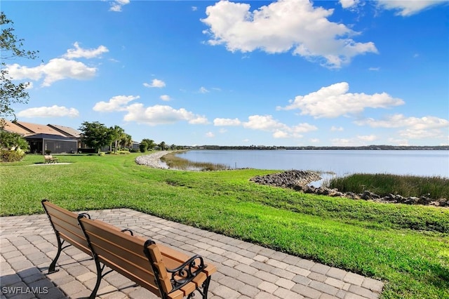 exterior space with a water view and a yard