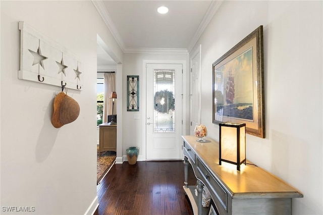 foyer with dark hardwood / wood-style floors and crown molding