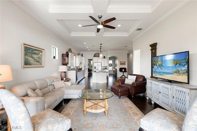 living room with beam ceiling, ceiling fan, coffered ceiling, hardwood / wood-style floors, and ornamental molding