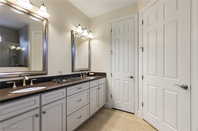 bathroom with tile patterned floors and vanity