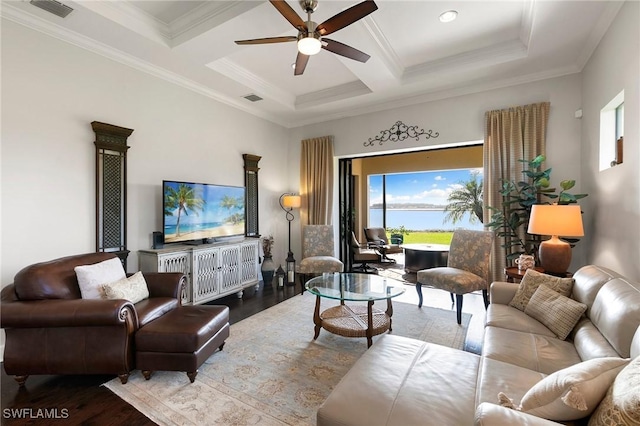 living room featuring ceiling fan, coffered ceiling, beamed ceiling, ornamental molding, and hardwood / wood-style flooring