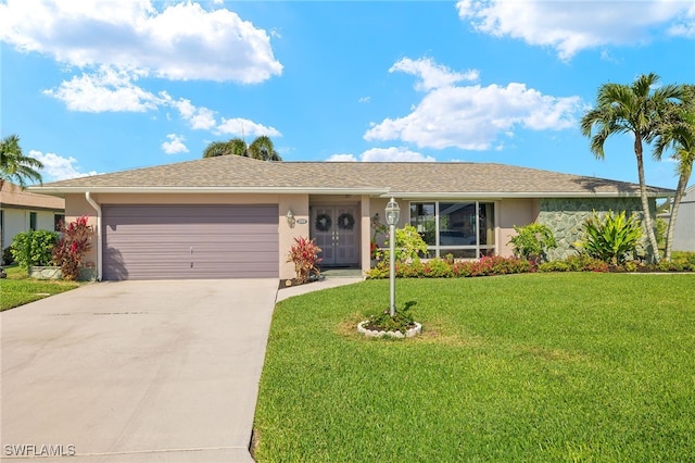 single story home featuring a garage and a front lawn