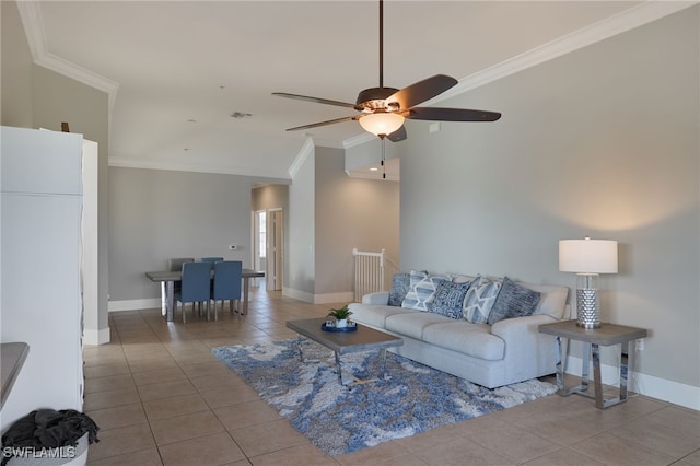 tiled living room featuring ceiling fan, lofted ceiling, and ornamental molding