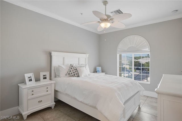 bedroom with ceiling fan, light tile patterned floors, and crown molding