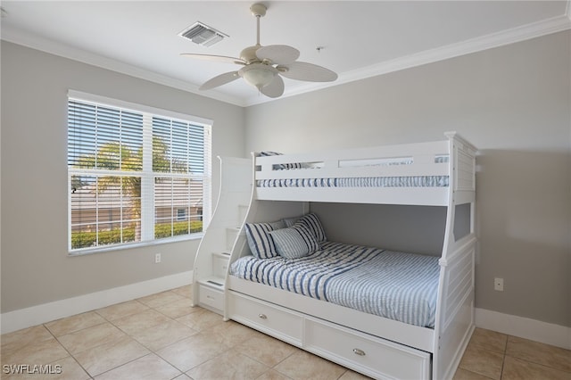 bedroom with ceiling fan, crown molding, and light tile patterned floors