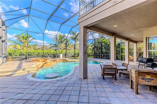 view of swimming pool featuring outdoor lounge area, glass enclosure, a patio area, and an in ground hot tub