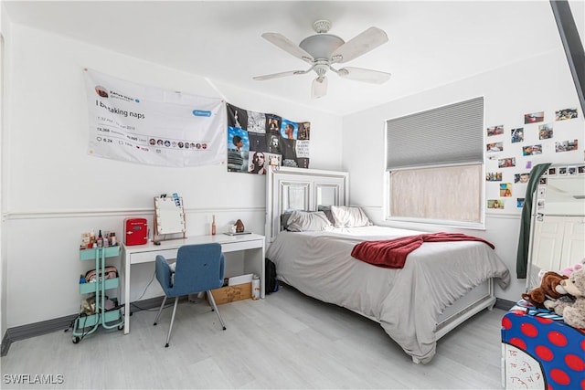 bedroom with ceiling fan and light hardwood / wood-style flooring