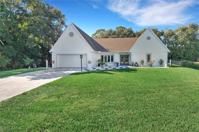 modern farmhouse style home with a garage and a front lawn