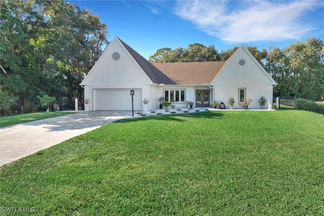 modern inspired farmhouse featuring a garage and a front lawn