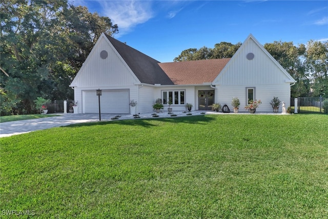 modern inspired farmhouse with a garage and a front lawn