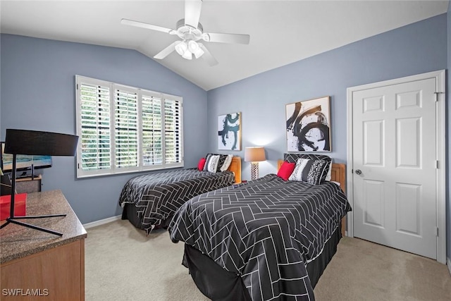 bedroom with ceiling fan, light carpet, and vaulted ceiling