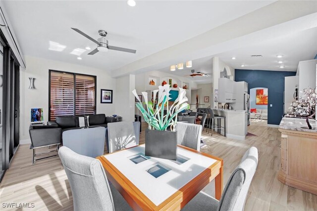 dining space featuring light hardwood / wood-style flooring and ceiling fan