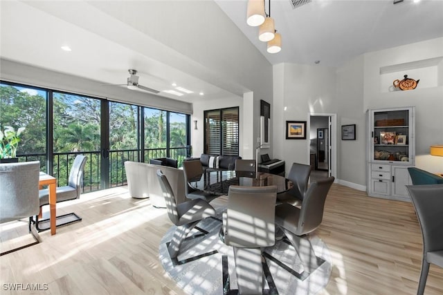 living room with light hardwood / wood-style floors and ceiling fan