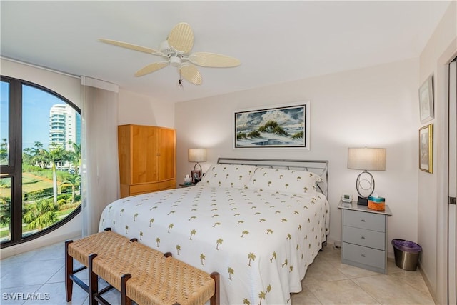 bedroom featuring ceiling fan and light tile patterned flooring