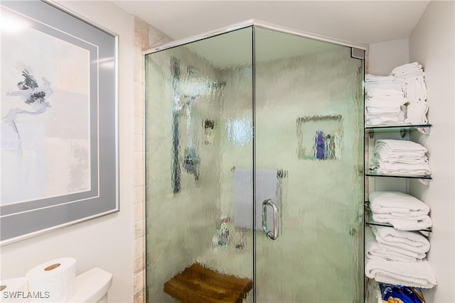 bathroom with a shower with shower door