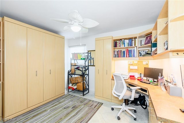 office with ceiling fan and light tile patterned flooring