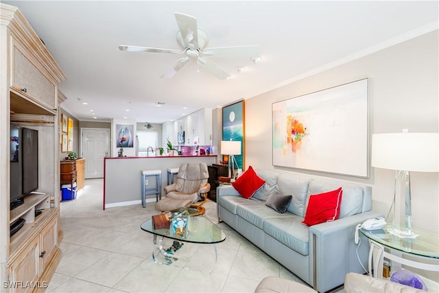 tiled living room featuring ceiling fan and crown molding