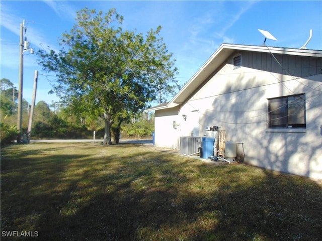 view of yard with central AC unit