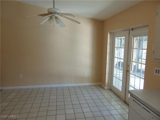 empty room with ceiling fan, light tile patterned flooring, and french doors