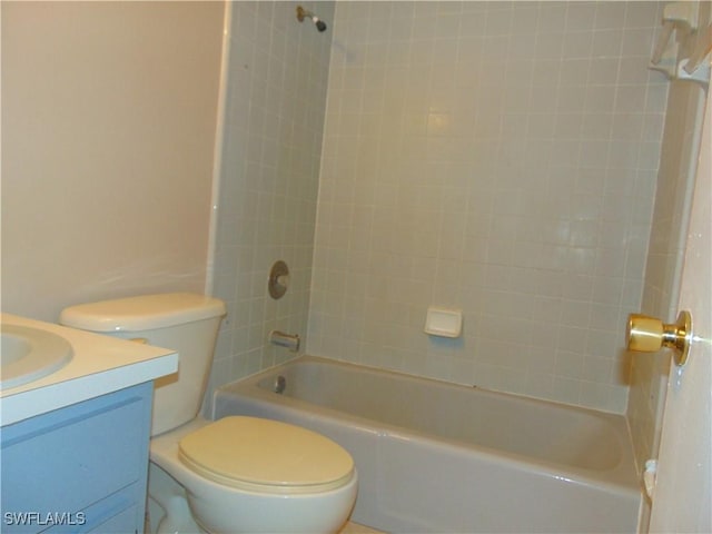 full bathroom with vanity, toilet, and tiled shower / bath