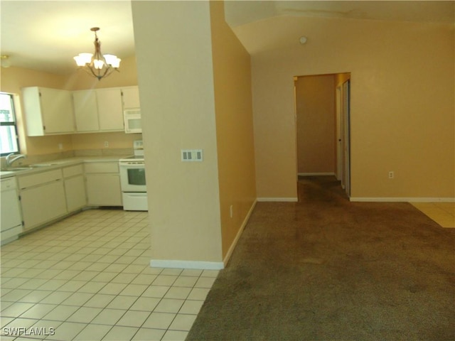 kitchen with a notable chandelier, light colored carpet, decorative light fixtures, white appliances, and white cabinets