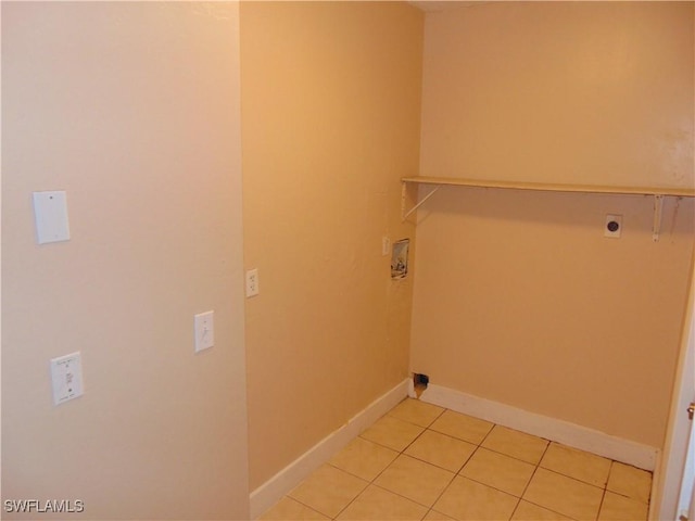 washroom featuring hookup for a washing machine, light tile patterned floors, and electric dryer hookup