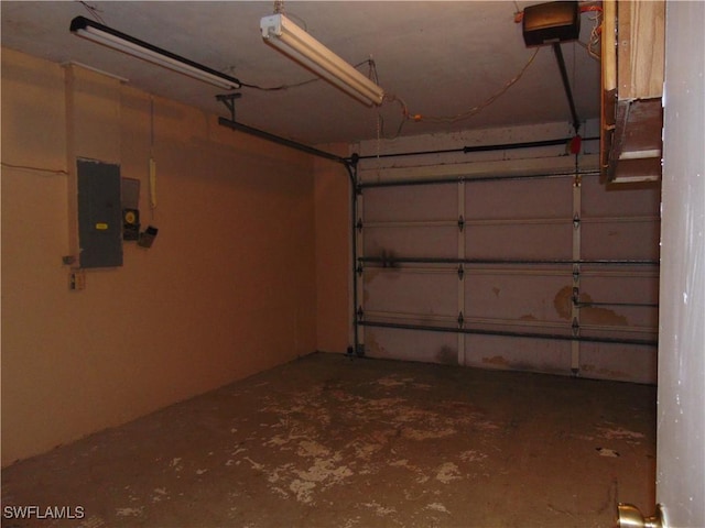 garage featuring a garage door opener and electric panel