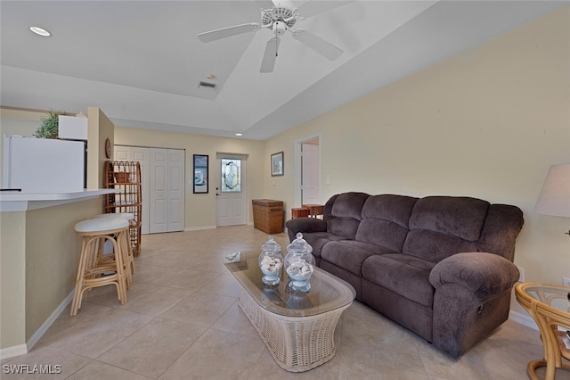 living room with ceiling fan and light tile patterned floors