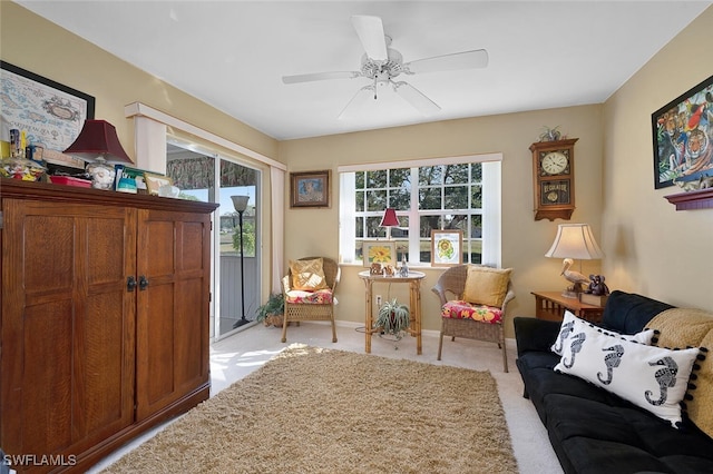 sitting room with light carpet and ceiling fan