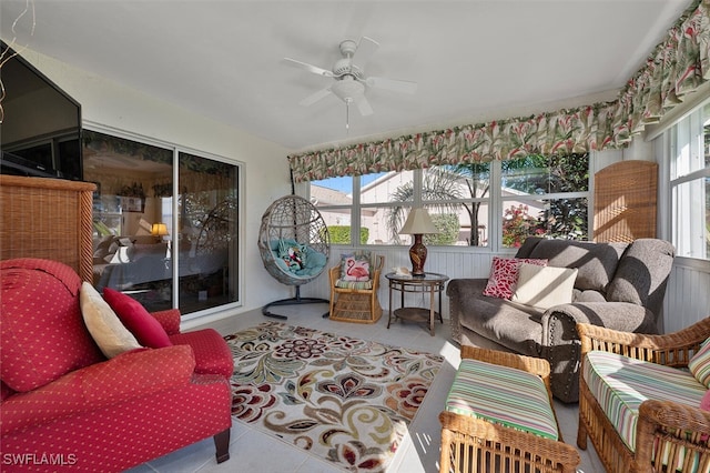 sunroom featuring ceiling fan