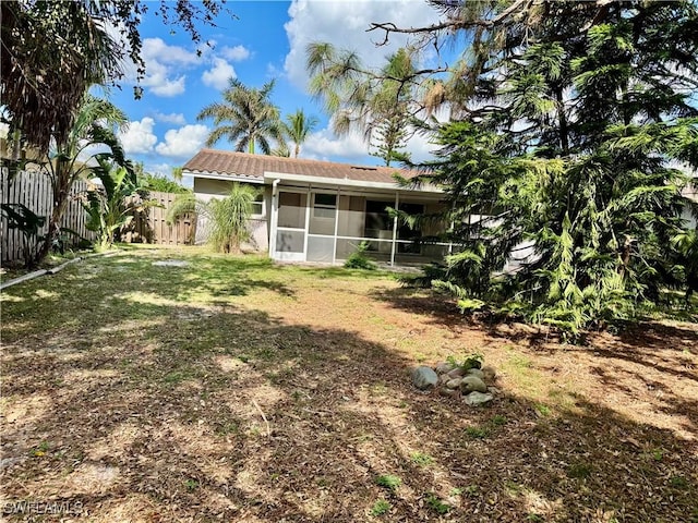 view of yard featuring a sunroom