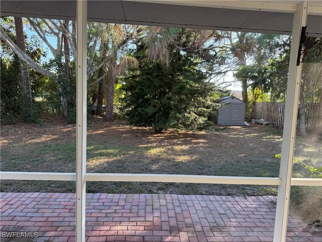 view of yard featuring a storage unit