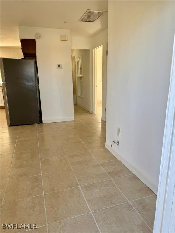 interior space featuring light tile patterned floors